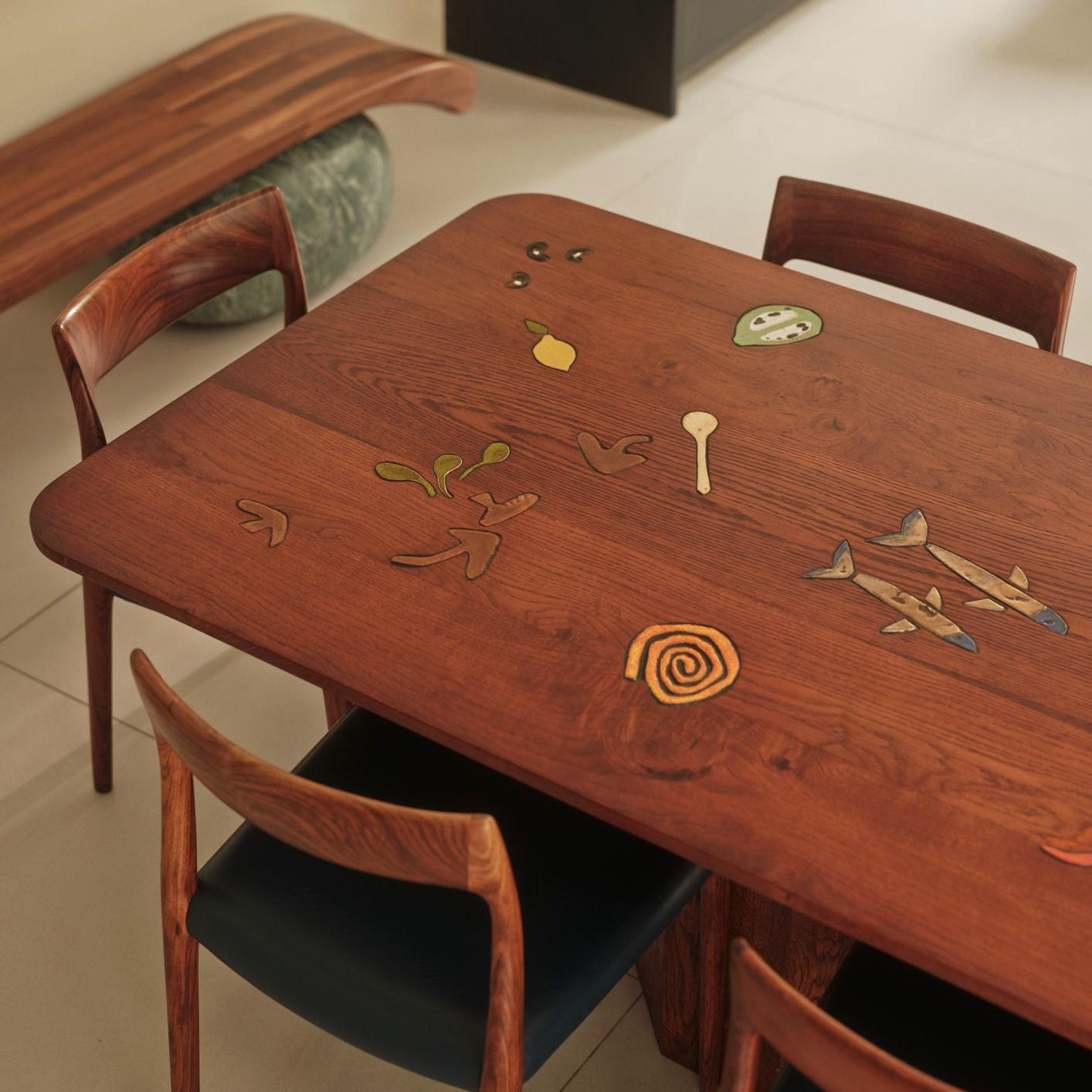An oak table with ceramic inlays