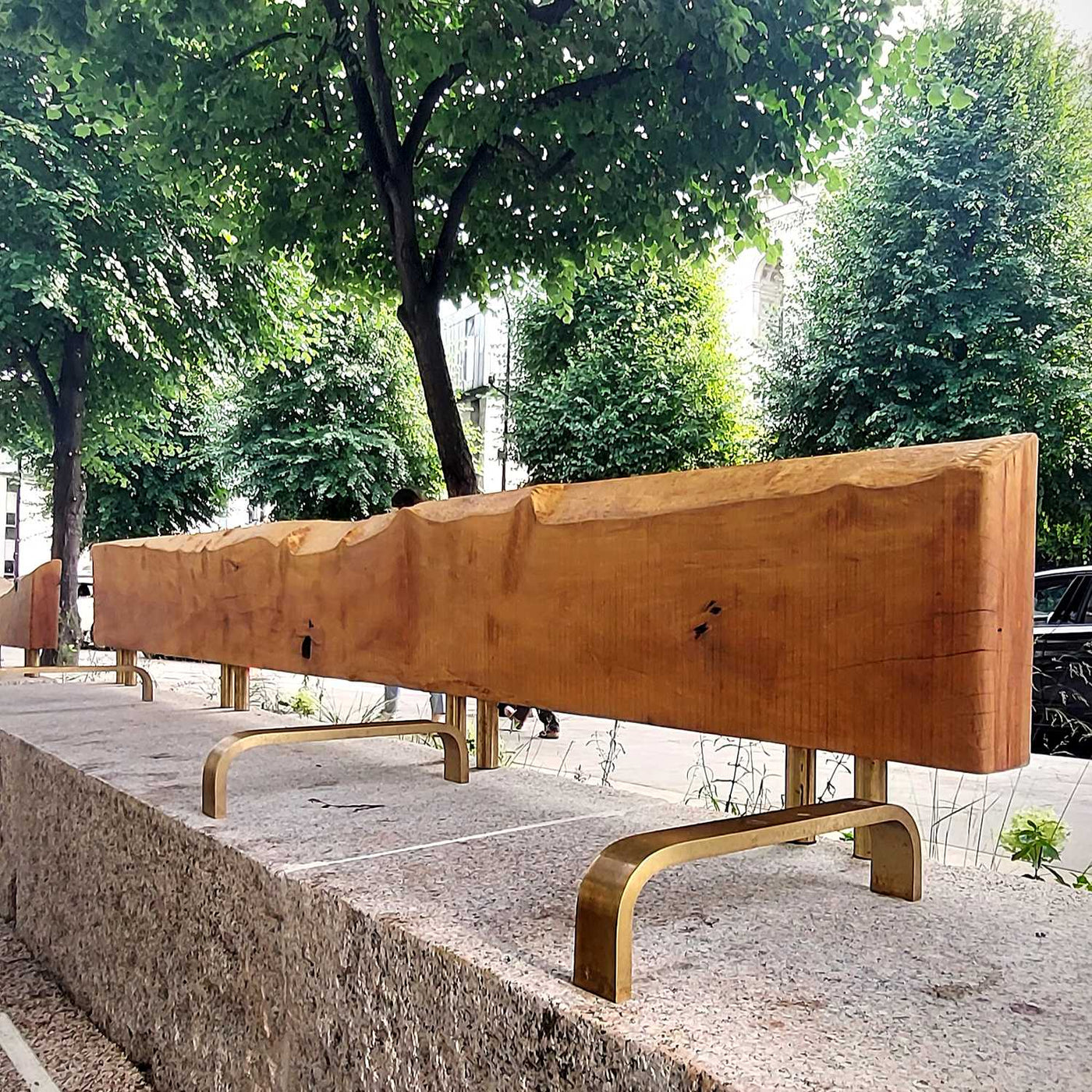 A wooden seat backrest at New Change Gardens made of salvaged London plane