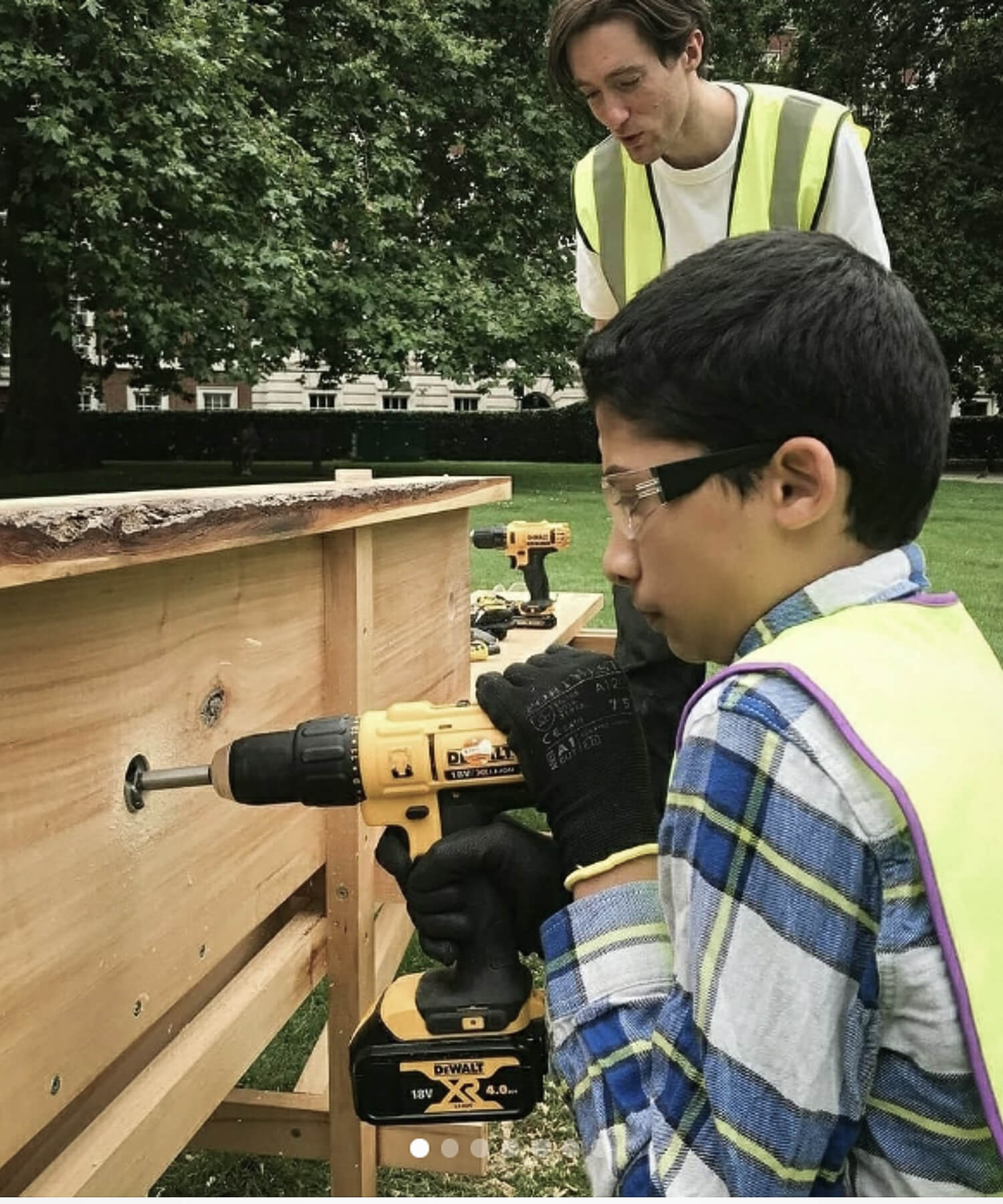Young man drilling timber in Grosvenor Square London