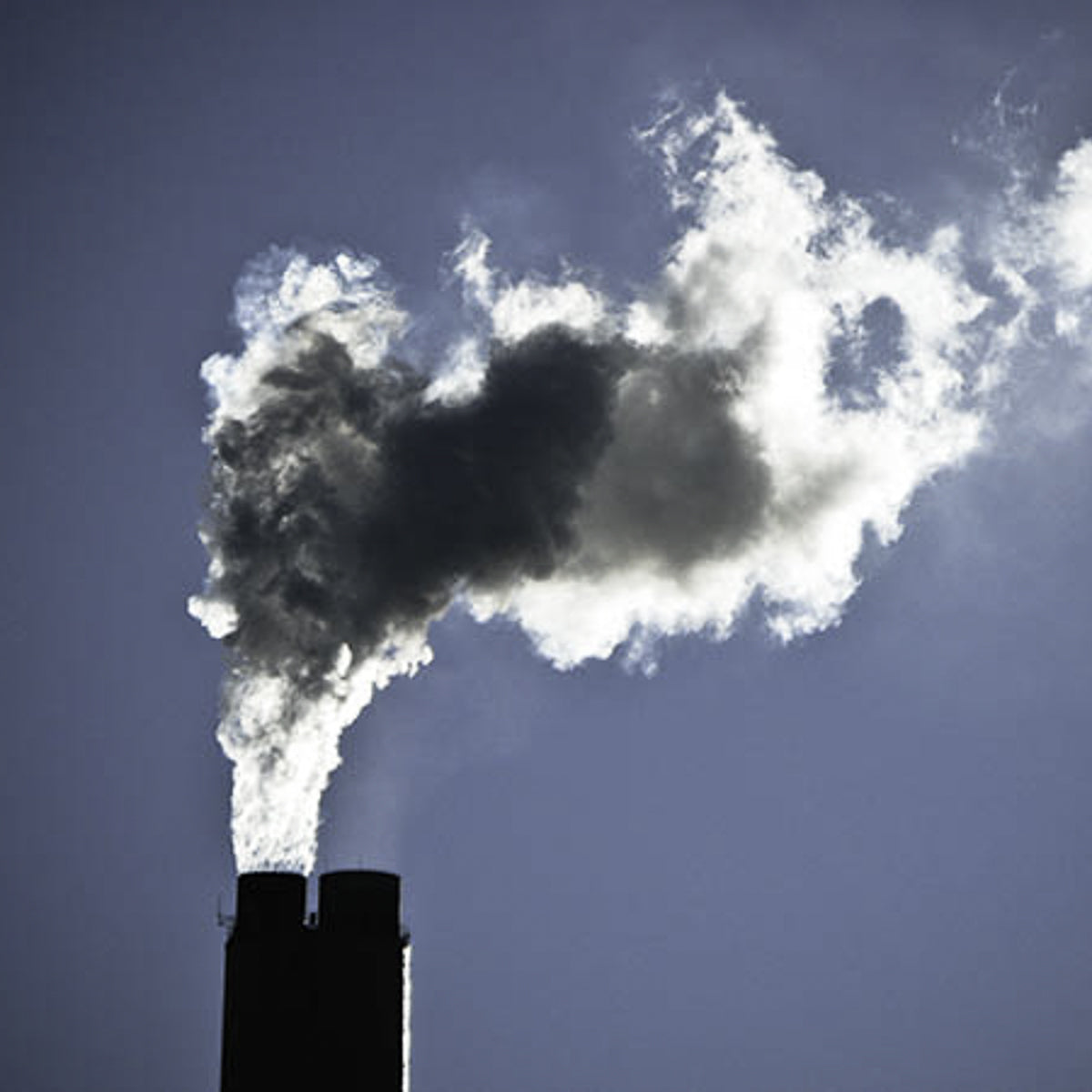 Smoke coming out of an industrial chimney