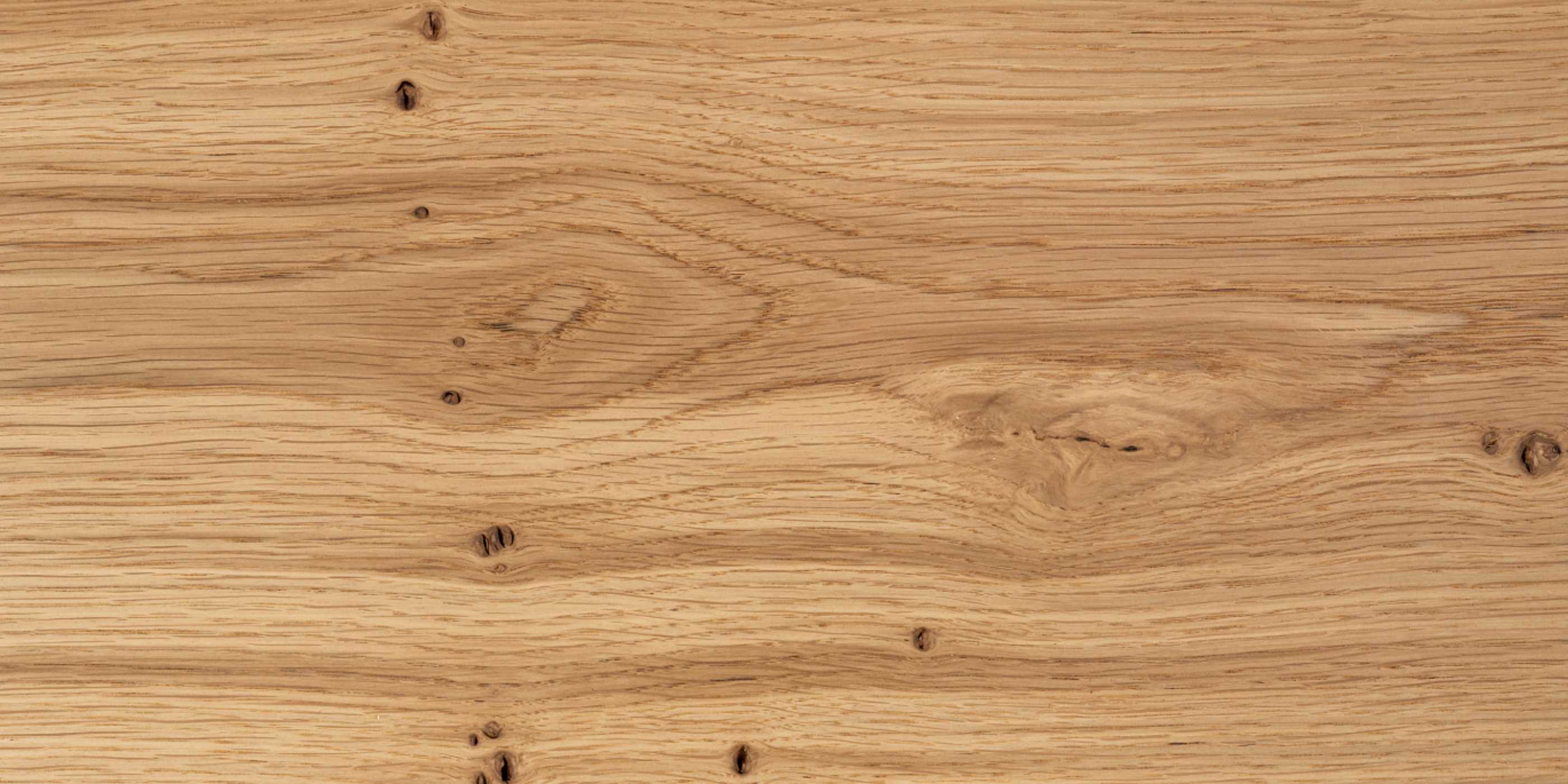 Close-up of an oak wood board with a natural grain pattern