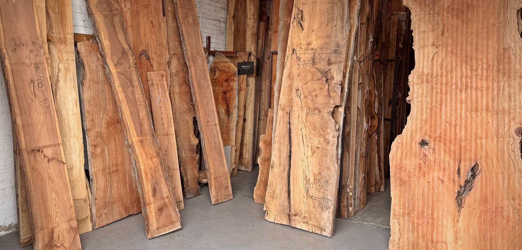 Hardwood timber boards displayed in Fallen & Felled's Essex timber yard
